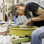 Student working in clay